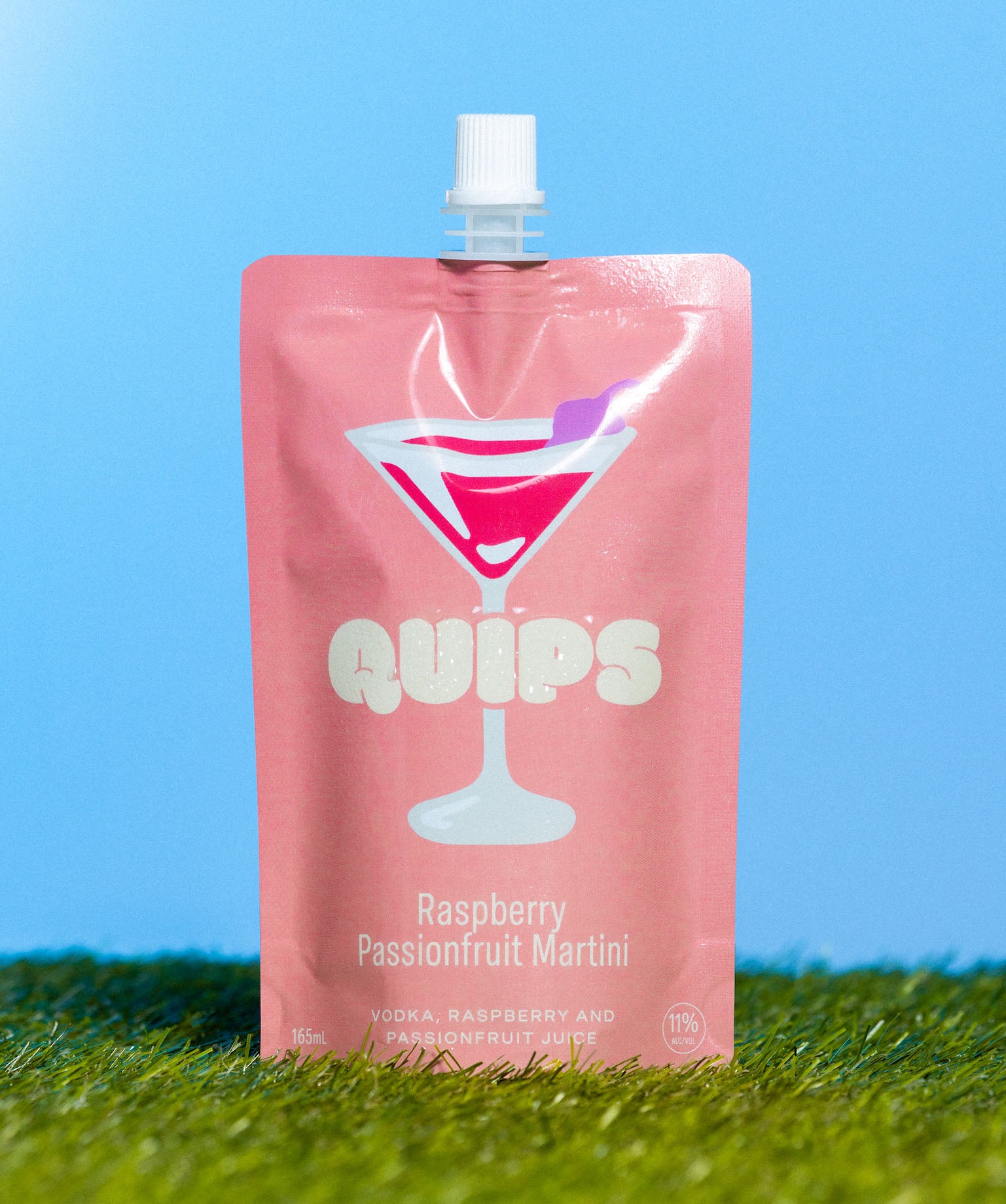 A pink cocktail pouch labeled 'Quips Raspberry Passionfruit Martini' with an illustration of a cocktail glass on the front.